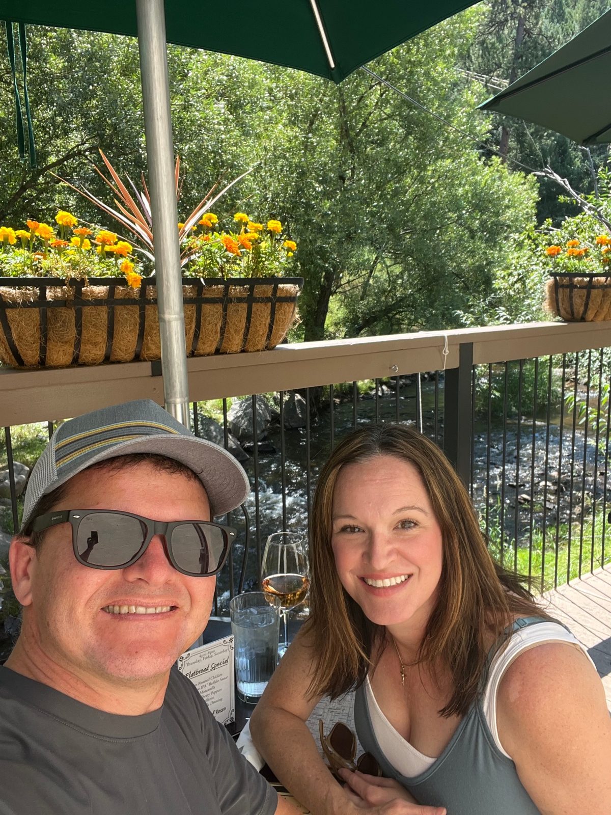 Julie and Jay dining beside a creek