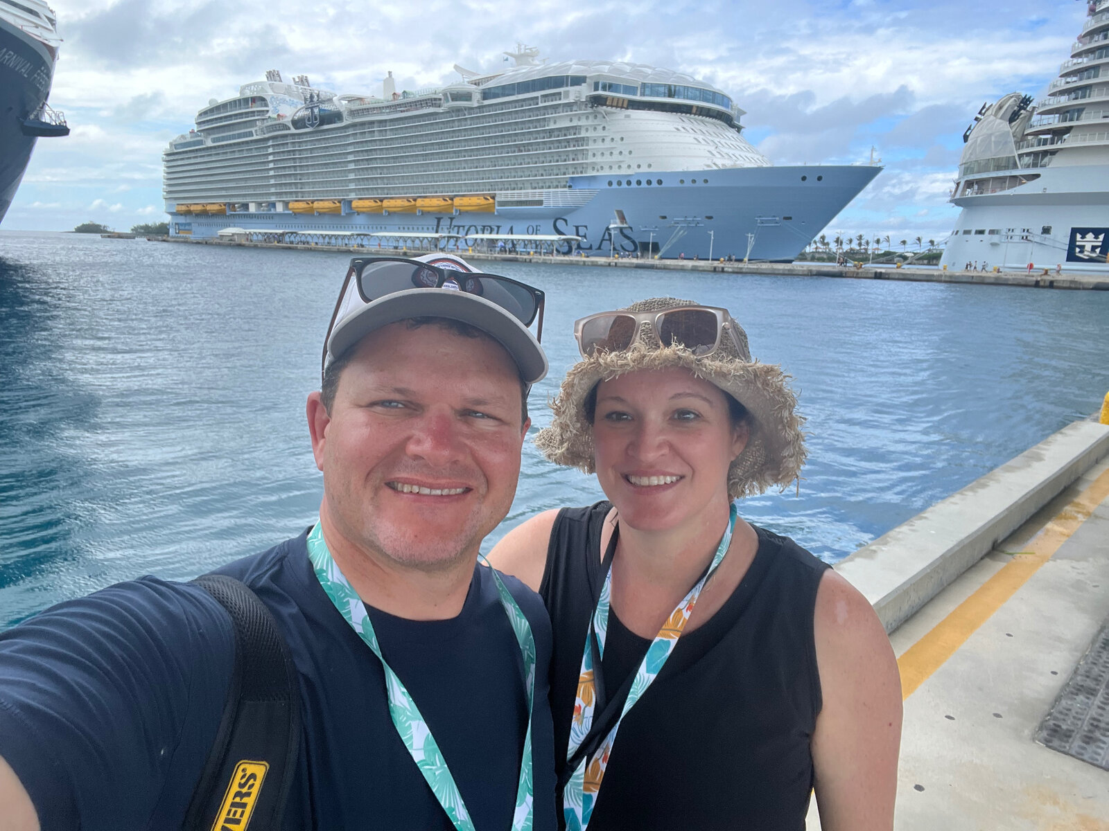 Julie and Jay selfie in front of a cruise ship