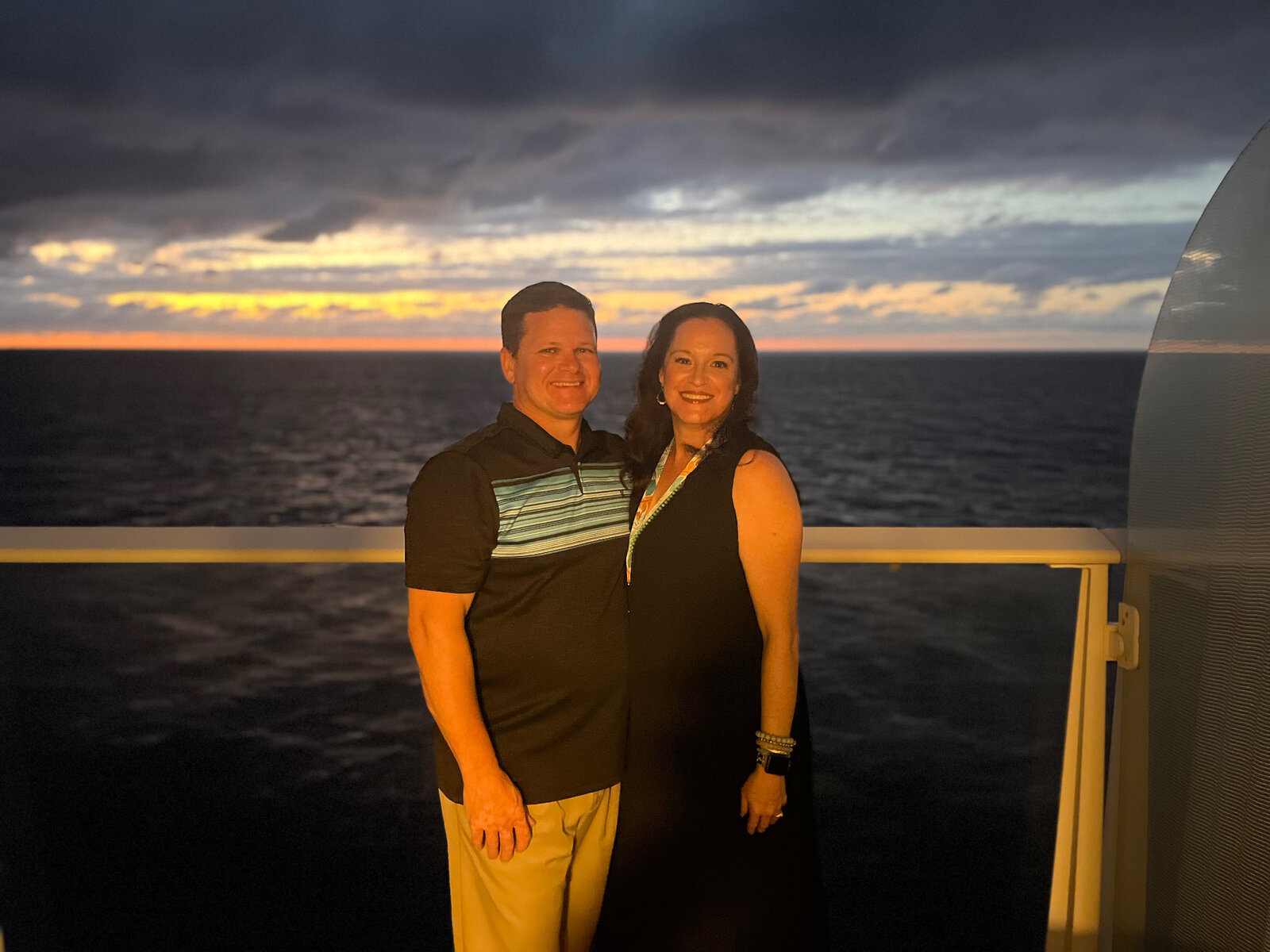Julie and Jay on a cruise ship at sunset