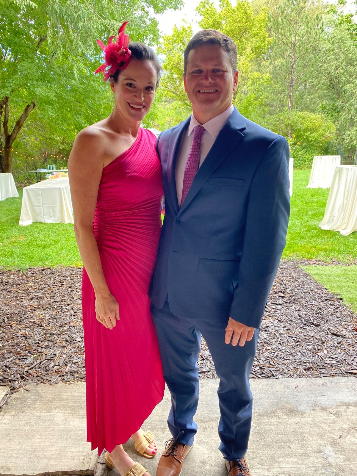 Julie and Jay dressed up at an outdoor celebration