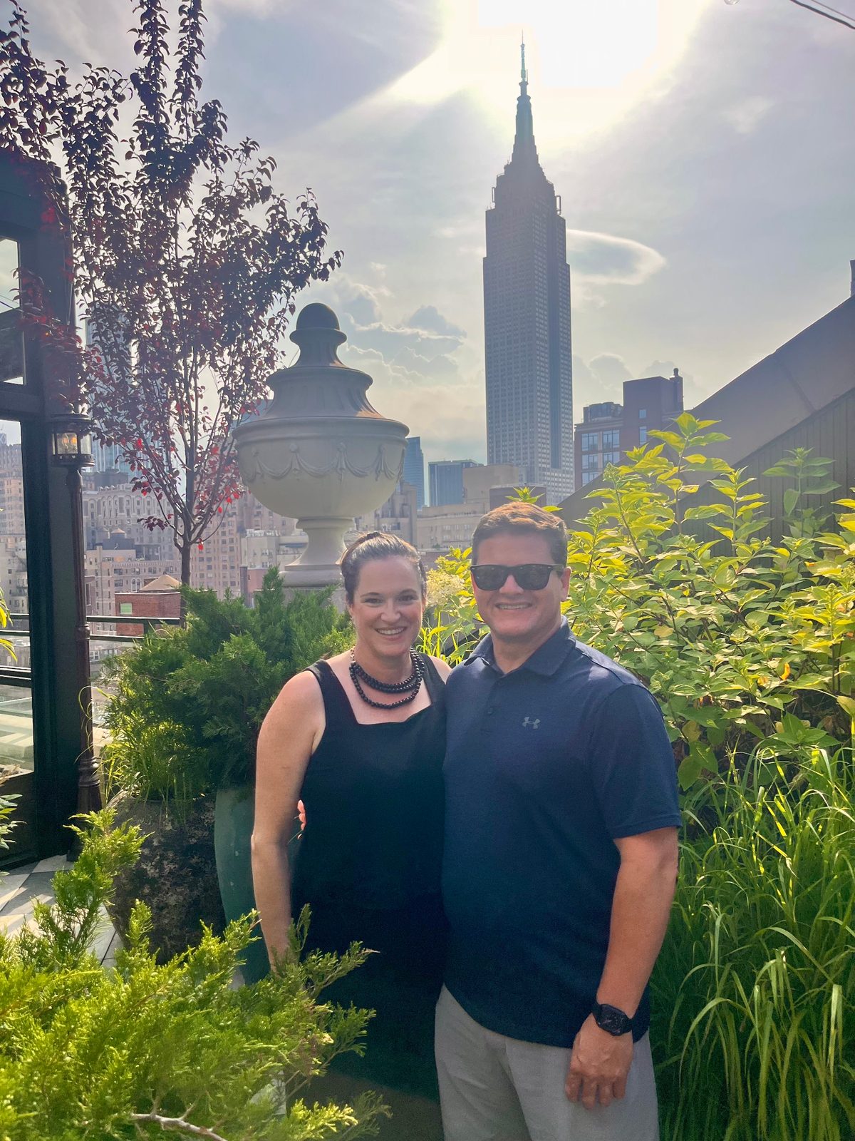 Julie and Jay on a NYC rooftop with the Empire State Building